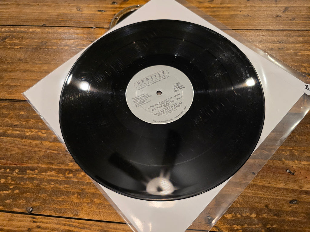 Rock Master Scott & the Dynamic Three – The Roof Is on Fire (12" Single, Reality Records, D-239)