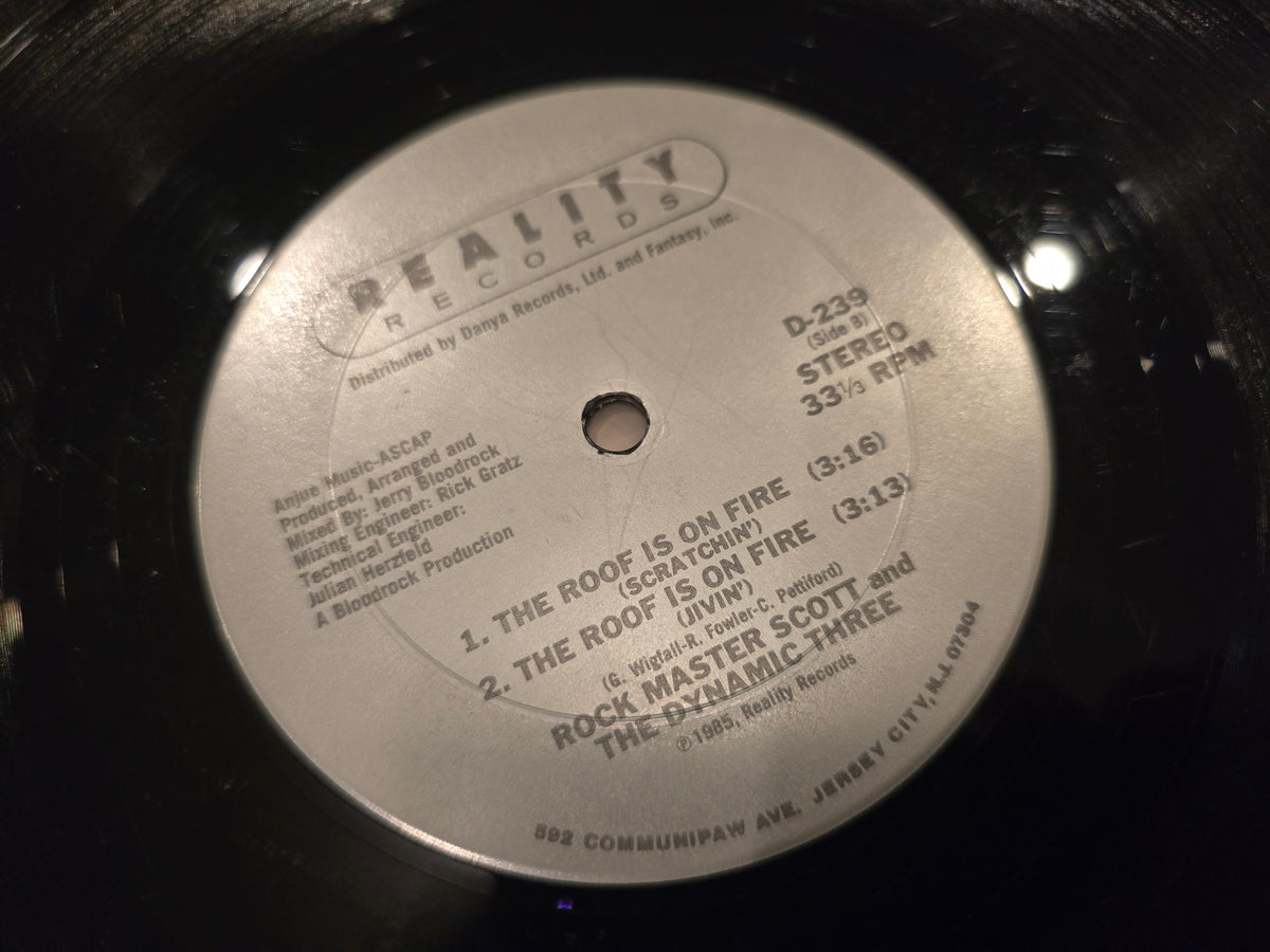 Rock Master Scott & the Dynamic Three – The Roof Is on Fire (12" Single, Reality Records, D-239)